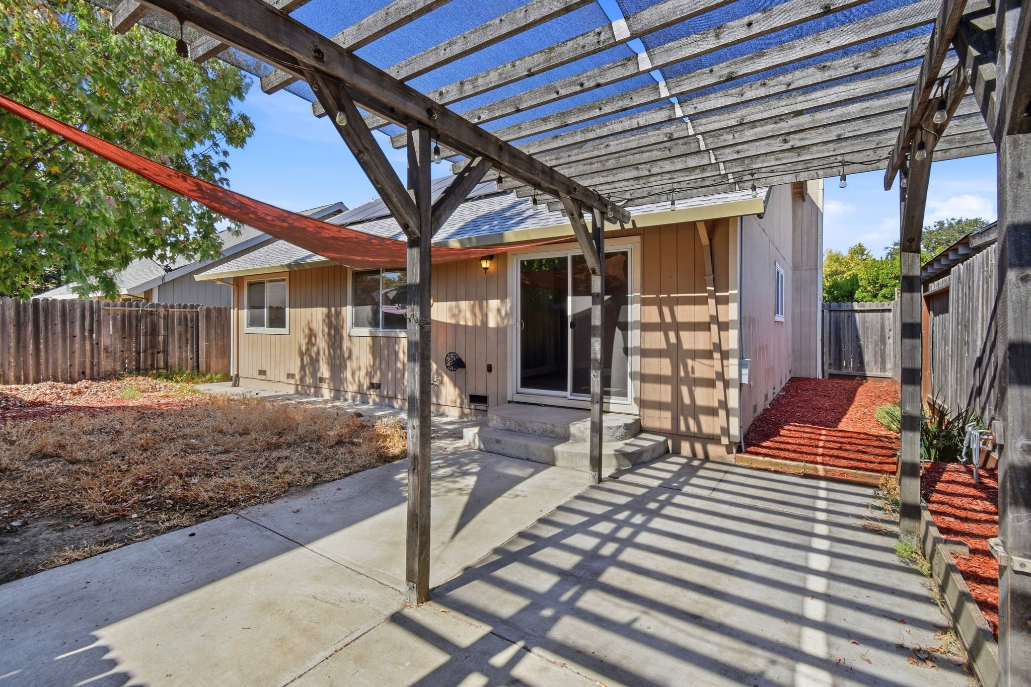 The backyard patio of a single-family home in Windsor managed by Bay Vista PM.